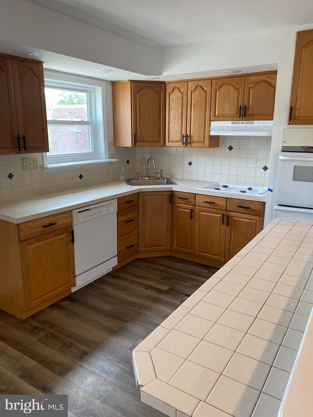 1148 Tabor Plz, Philadelphia, PA 19111 - kitchen featuring a sink, white appliances, dark wood-type flooring, backsplash, and under cabinet range hood