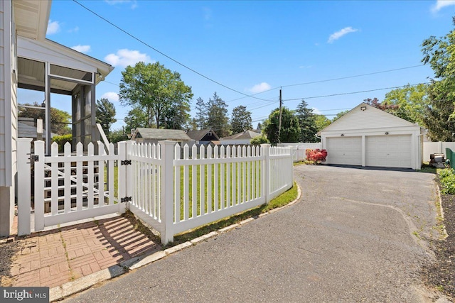 226 Washington Ter, Audubon, NJ 08106 - exterior space with a detached garage, an outdoor structure, and a gate