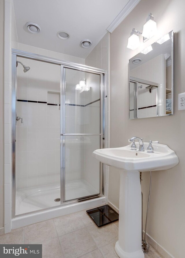 bathroom featuring a stall shower and tile patterned flooring