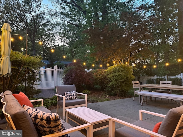 view of patio featuring an outdoor hangout area, outdoor dining area, and a fenced backyard