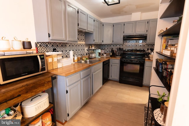4 Country Ln, Westampton, NJ 08060 - kitchen with black appliances, under cabinet range hood, open shelves, a sink, and tasteful backsplash