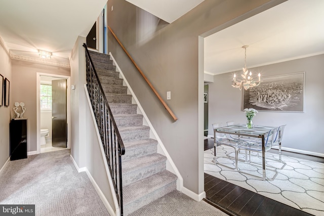 1109 Neal Dr, Alexandria, VA 22308 - staircase with a chandelier, ornamental molding, baseboards, wood finished floors, and carpet flooring