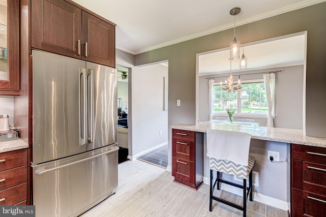 1109 Neal Dr, Alexandria, VA 22308 - kitchen with freestanding refrigerator, ornamental molding, decorative light fixtures, a chandelier, and light stone countertops