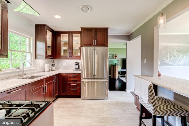 1109 Neal Dr, Alexandria, VA 22308 - kitchen with freestanding refrigerator, a sink, light stone counters, crown molding, and glass insert cabinets