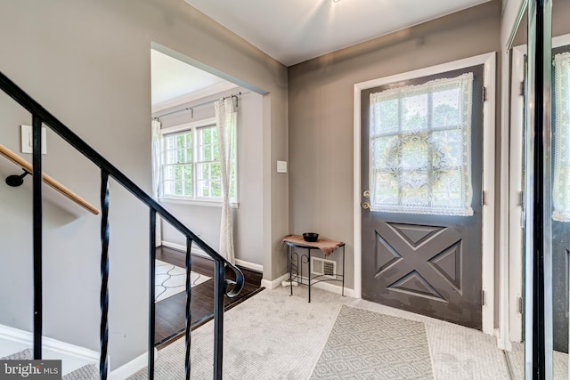 1109 Neal Dr, Alexandria, VA 22308 - entrance foyer with carpet, stairway, and baseboards