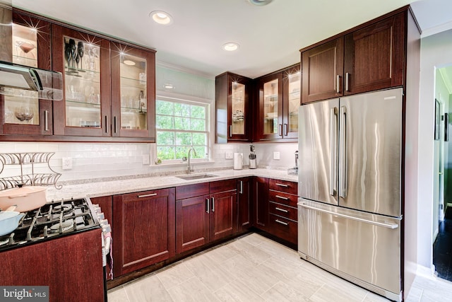 1109 Neal Dr, Alexandria, VA 22308 - kitchen with stainless steel appliances, a sink, light stone counters, backsplash, and recessed lighting