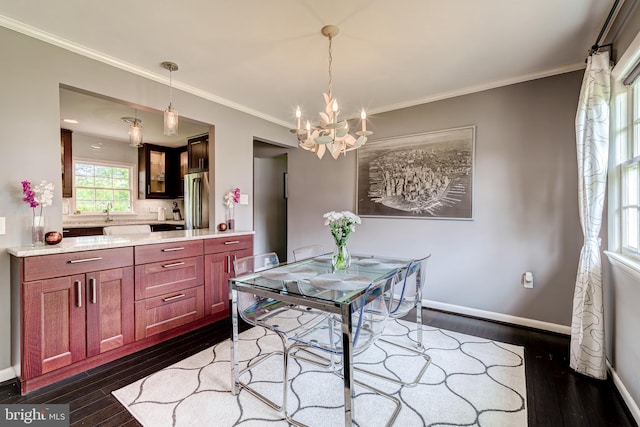 1109 Neal Dr, Alexandria, VA 22308 - dining space with dark wood-type flooring, a chandelier, ornamental molding, and baseboards
