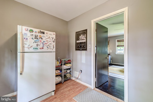 1109 Neal Dr, Alexandria, VA 22308 - kitchen featuring freestanding refrigerator, wood finished floors, and baseboards
