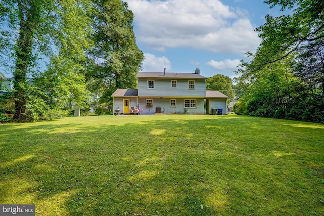 1109 Neal Dr, Alexandria, VA 22308 - rear view of property with a yard and a chimney