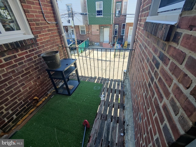 view of patio featuring a balcony