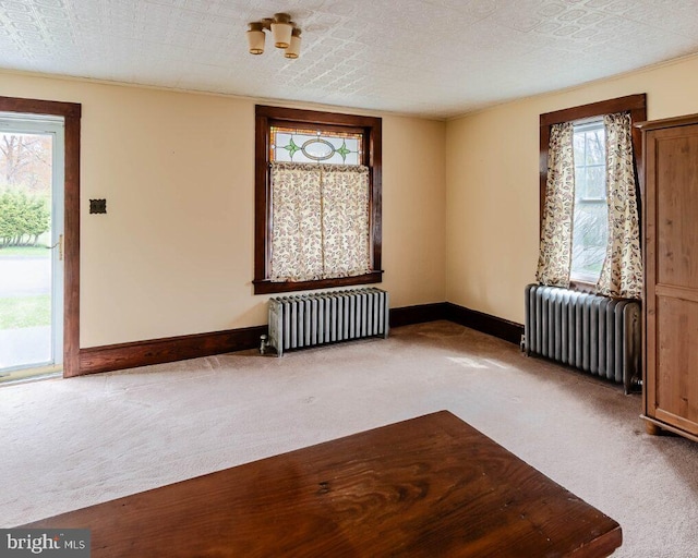 interior space featuring baseboards and radiator heating unit