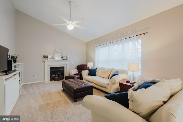 living room with baseboards, ceiling fan, high vaulted ceiling, light colored carpet, and a fireplace with flush hearth