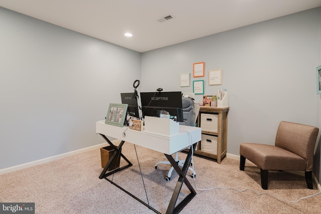 office area featuring visible vents, recessed lighting, baseboards, and light carpet