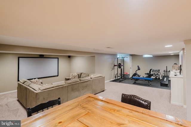 workout room with baseboards and carpet