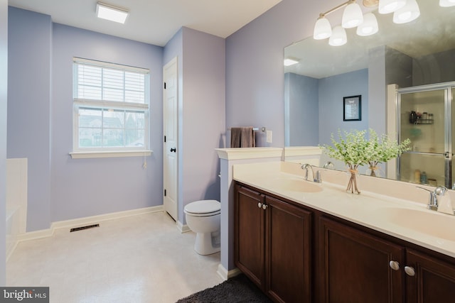 full bathroom with a sink, baseboards, a stall shower, and visible vents