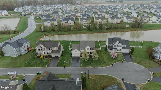 aerial view featuring a water view and a residential view