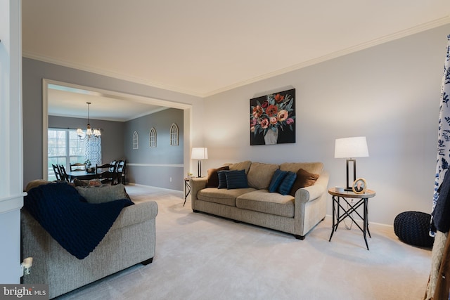 living room featuring crown molding, baseboards, a notable chandelier, and light carpet