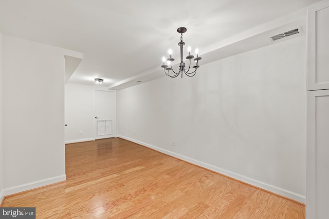 1521 N Van Dorn St, Alexandria, VA 22304 - spare room with light wood-style flooring, baseboards, and a chandelier