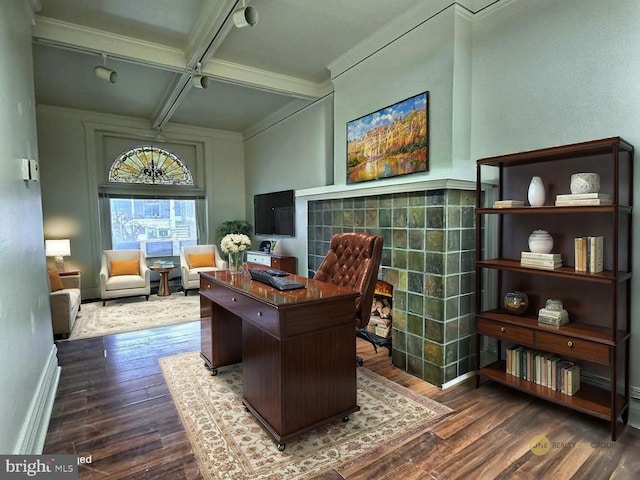 office space featuring ornamental molding, dark wood-style flooring, beamed ceiling, baseboards, and coffered ceiling