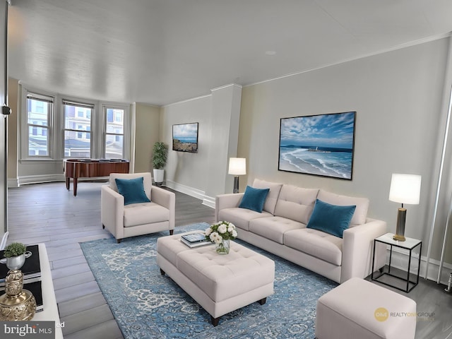 living room featuring baseboards and wood finished floors