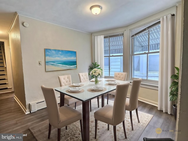 dining room with baseboards, dark wood-style floors, and ornamental molding