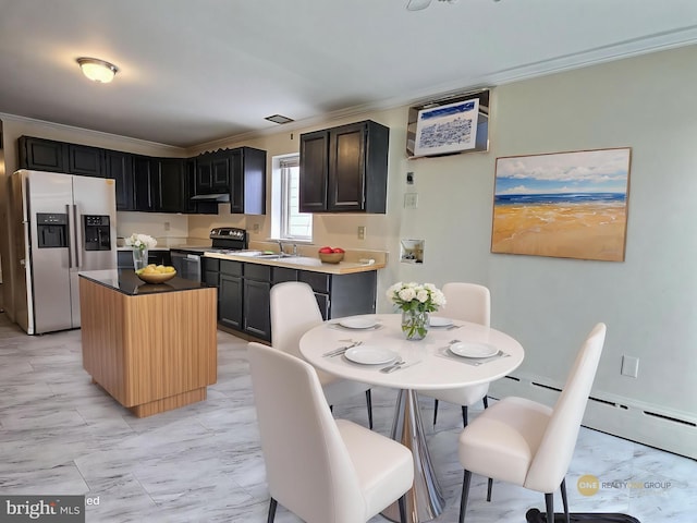 kitchen with crown molding, a center island, stainless steel appliances, and marble finish floor