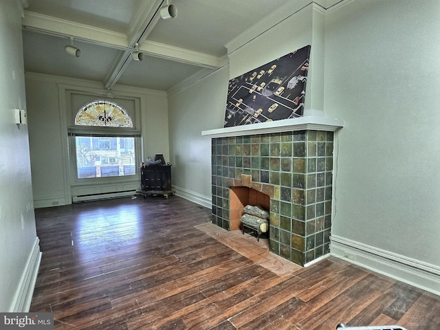 unfurnished living room with a fireplace with flush hearth, beam ceiling, hardwood / wood-style flooring, and coffered ceiling