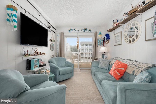 living area with a textured ceiling