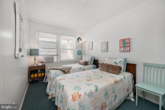 bedroom featuring carpet flooring, a textured ceiling, and baseboards