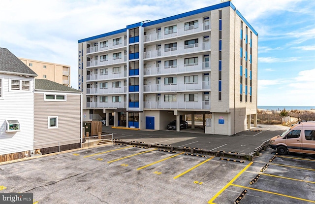 view of property with uncovered parking