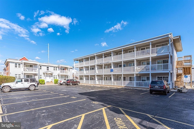 view of property featuring uncovered parking