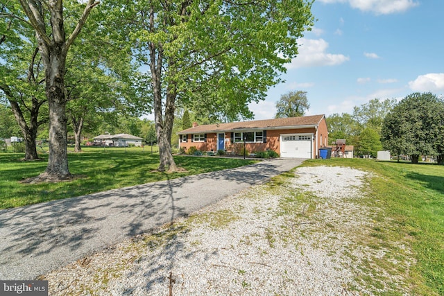 ranch-style home with a front lawn, driveway, a chimney, and a garage