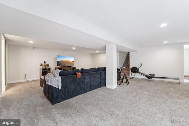 carpeted living area featuring stairway, baseboards, and recessed lighting