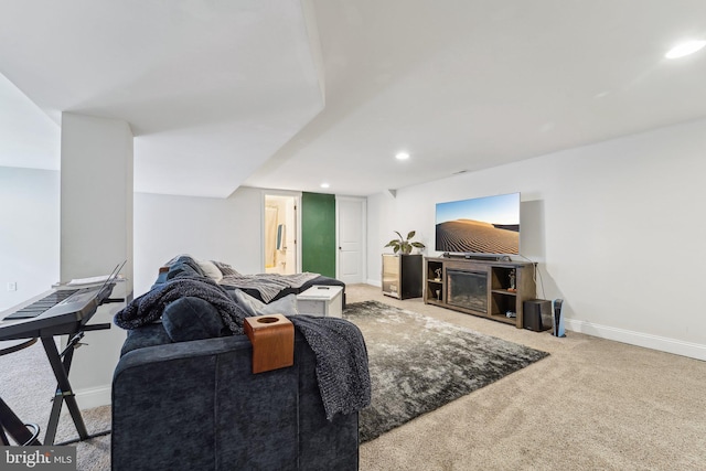 carpeted living room featuring baseboards and recessed lighting