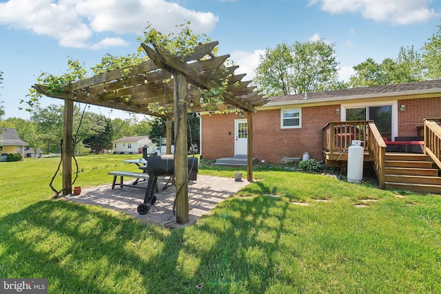 view of yard with a pergola, a deck, and a patio