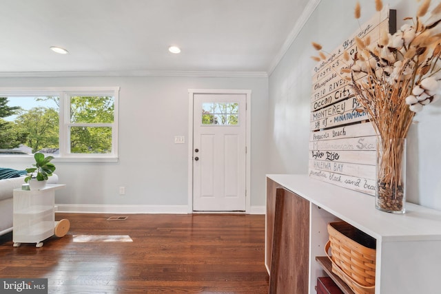 foyer entrance featuring wood finished floors, baseboards, ornamental molding, and recessed lighting