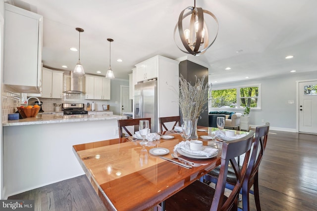 dining room with baseboards, dark wood-style floors, and recessed lighting