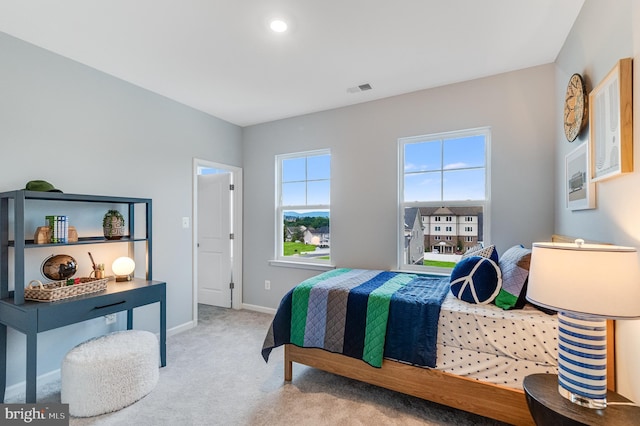 bedroom featuring carpet floors, baseboards, and visible vents