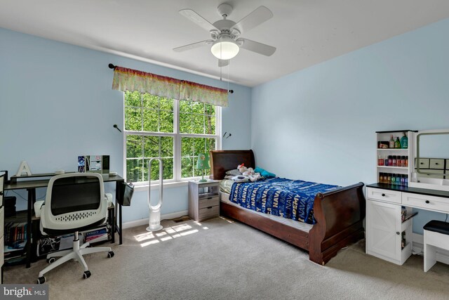 bedroom with ceiling fan and light carpet