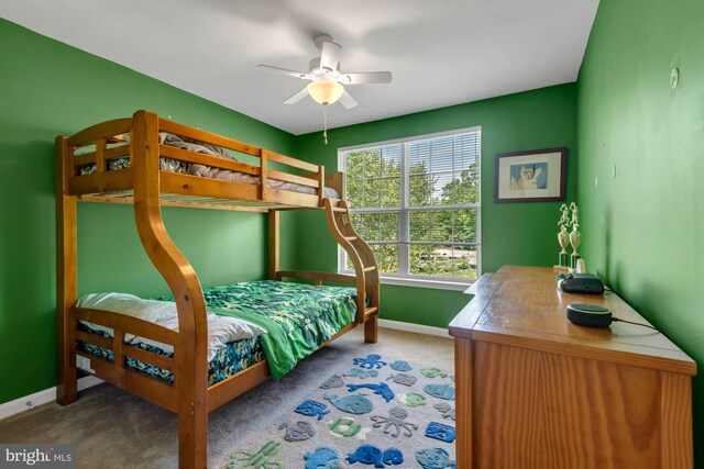 bedroom featuring baseboards, a ceiling fan, and carpet flooring