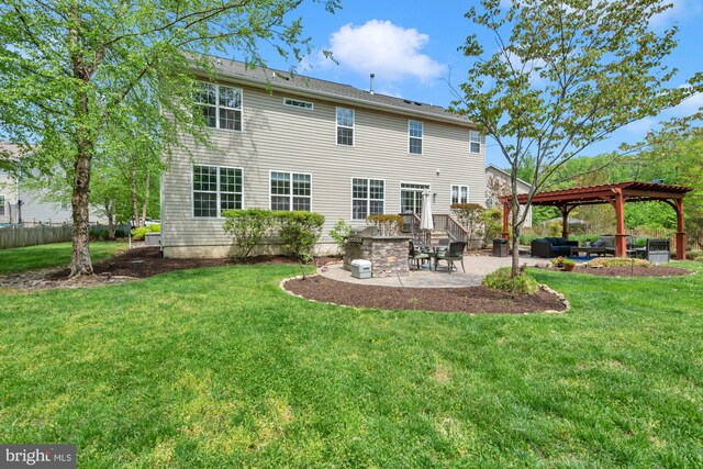 rear view of house featuring a lawn, a patio, a gazebo, and fence