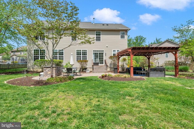 rear view of house featuring a lawn, a patio area, a gazebo, and entry steps