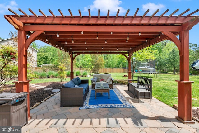 view of patio featuring an outdoor living space, a trampoline, fence, and a pergola