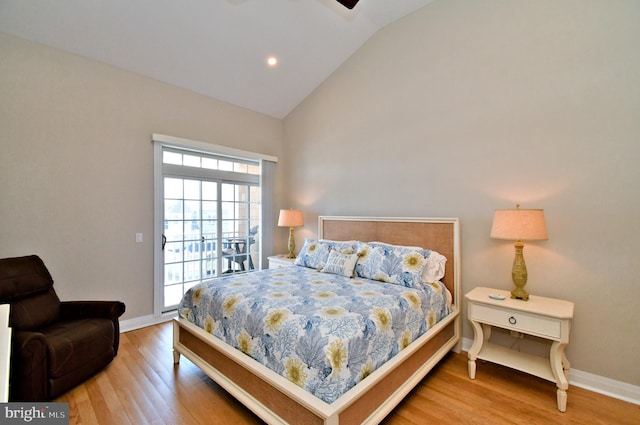 bedroom with wood finished floors, access to exterior, baseboards, high vaulted ceiling, and recessed lighting