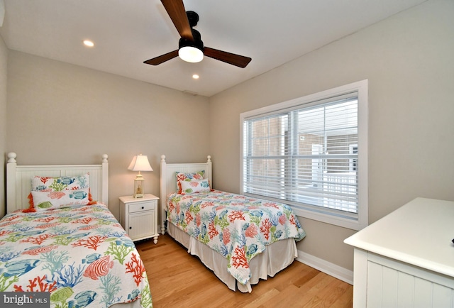bedroom with light wood-type flooring, recessed lighting, baseboards, and ceiling fan