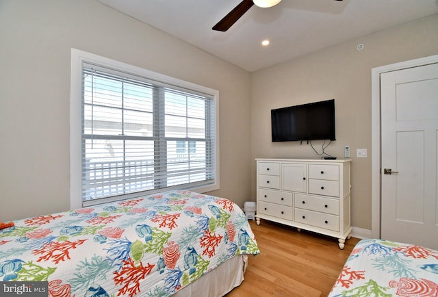 bedroom featuring recessed lighting, baseboards, ceiling fan, and light wood-type flooring