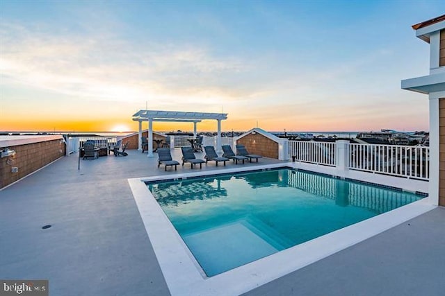 pool featuring a patio area, fence, and a pergola