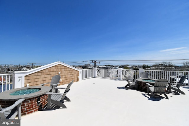 view of patio with a fire pit