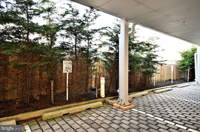 view of patio / terrace featuring fence