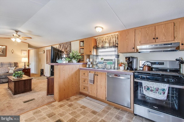 kitchen with ceiling fan, light countertops, stainless steel appliances, open floor plan, and under cabinet range hood